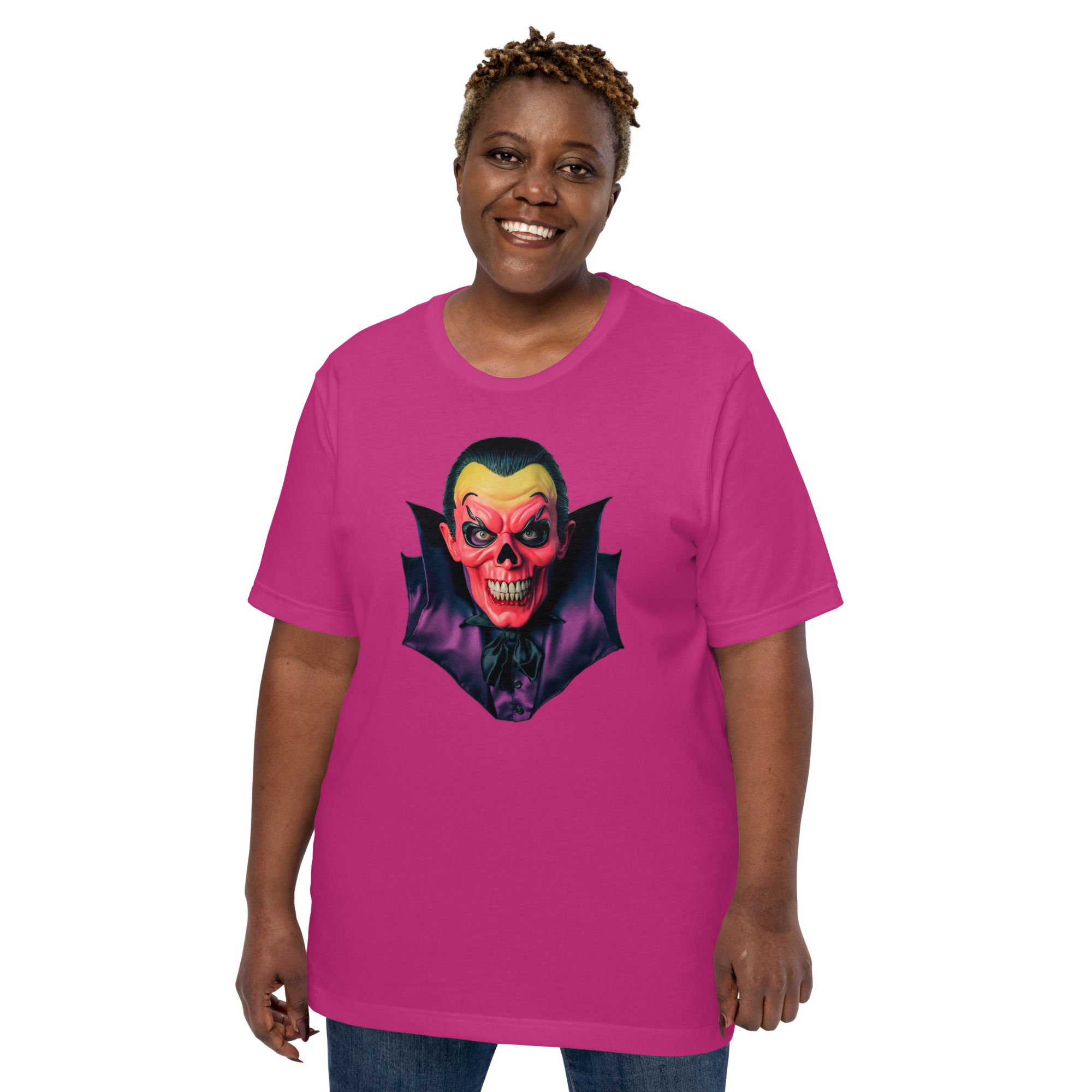 Person wearing pink T-shirt with vampire design.