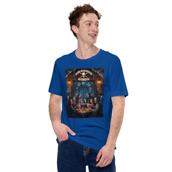 Man in blue graphic horror-themed T-shirt smiling.