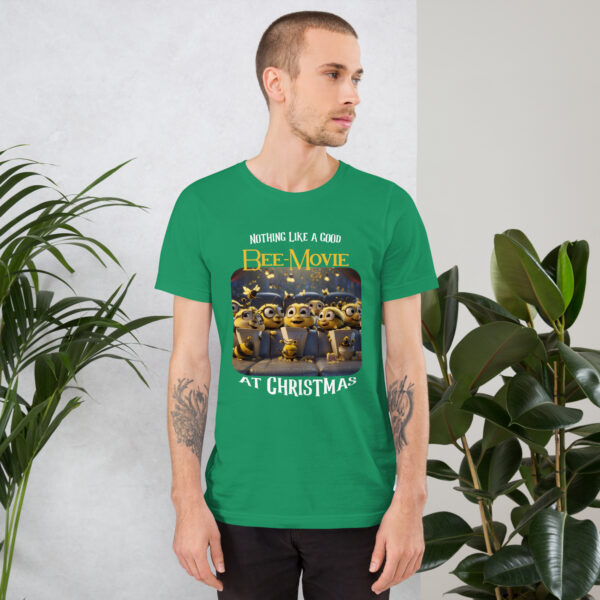 Man with green Bee-Movie Christmas t-shirt near plants.