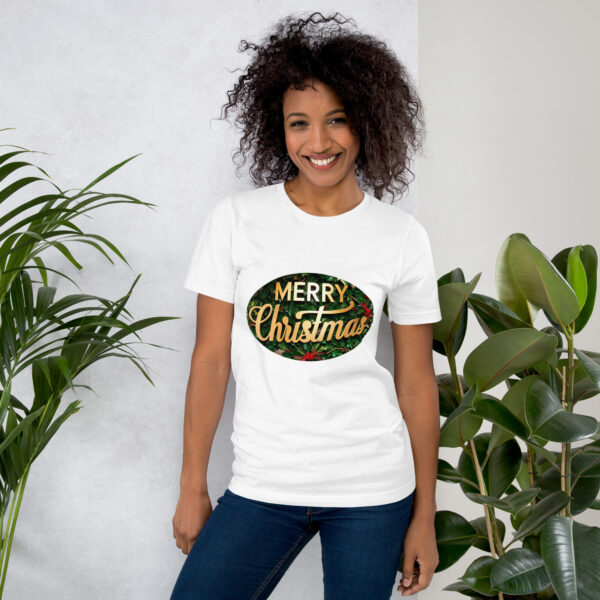 Smiling woman wearing Merry Christmas shirt, plants nearby.