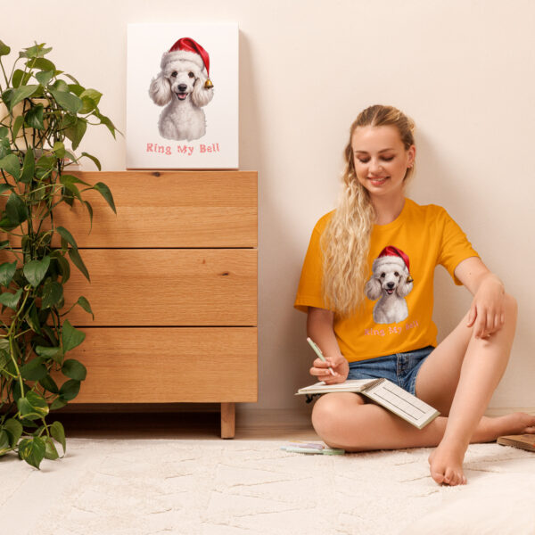 Woman wearing poodle Christmas t-shirt and writing.