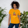 Woman in yellow T-shirt smiling by indoor plants.