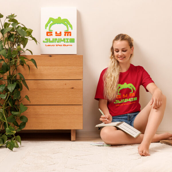 Woman in red t-shirt taking notes by plant