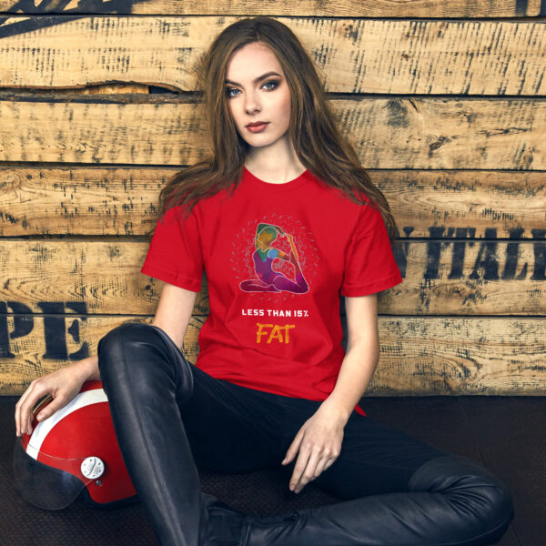 Model wearing red fitness-themed t-shirt indoors.